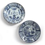 Two similar Kraak blue and white dishes Chinese one with urn of flowers within a panelled border