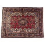 Red ground rug Hamadan with central foliate medallion within a blue foliate borderCondition