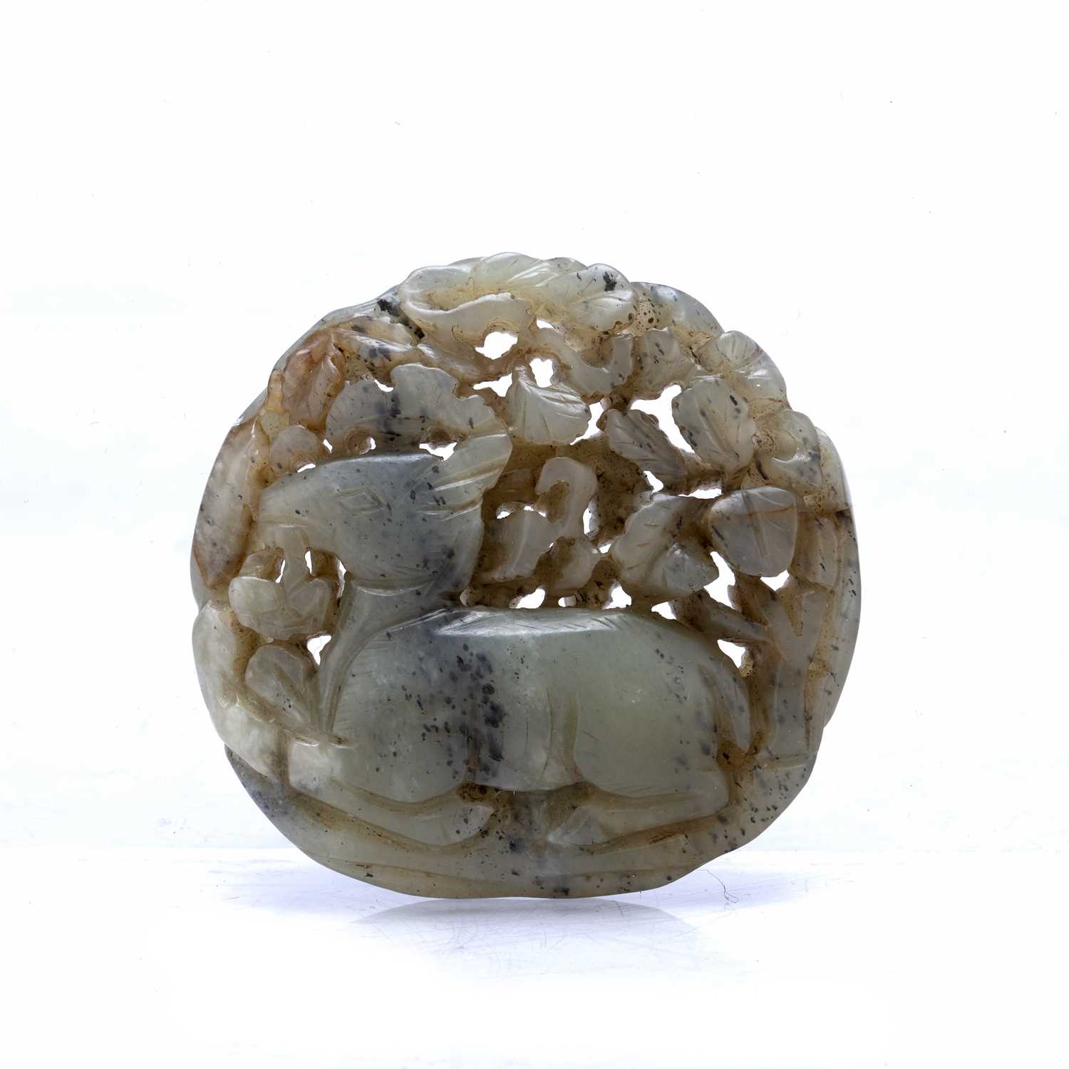 Pale green jade roundel Chinese with carved with a doe holding a ling chi fungus in its mouth, set