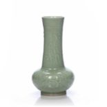 Longquan vase Chinese with moulded decoration to the exterior depicting flowers, with an elongated