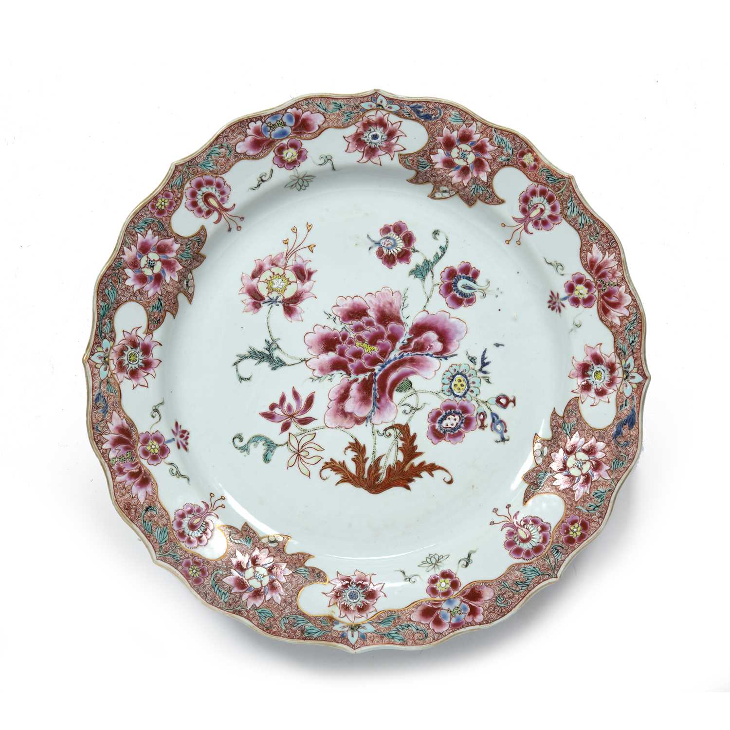 Famille rose charger Chinese, 18th Century with enamel flower decoration within a shaped diaper