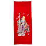 Red ground fabric panel Chinese depicting a standing Tung Fang with a staff in one hand and a deer