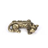 Brass-toned metal standing prowling Chi-lin Chinese, late Ming facing right, the body with well-