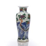 Polychrome decorated vase Chinese, 19th Century decorated with flowers growing from a rocky