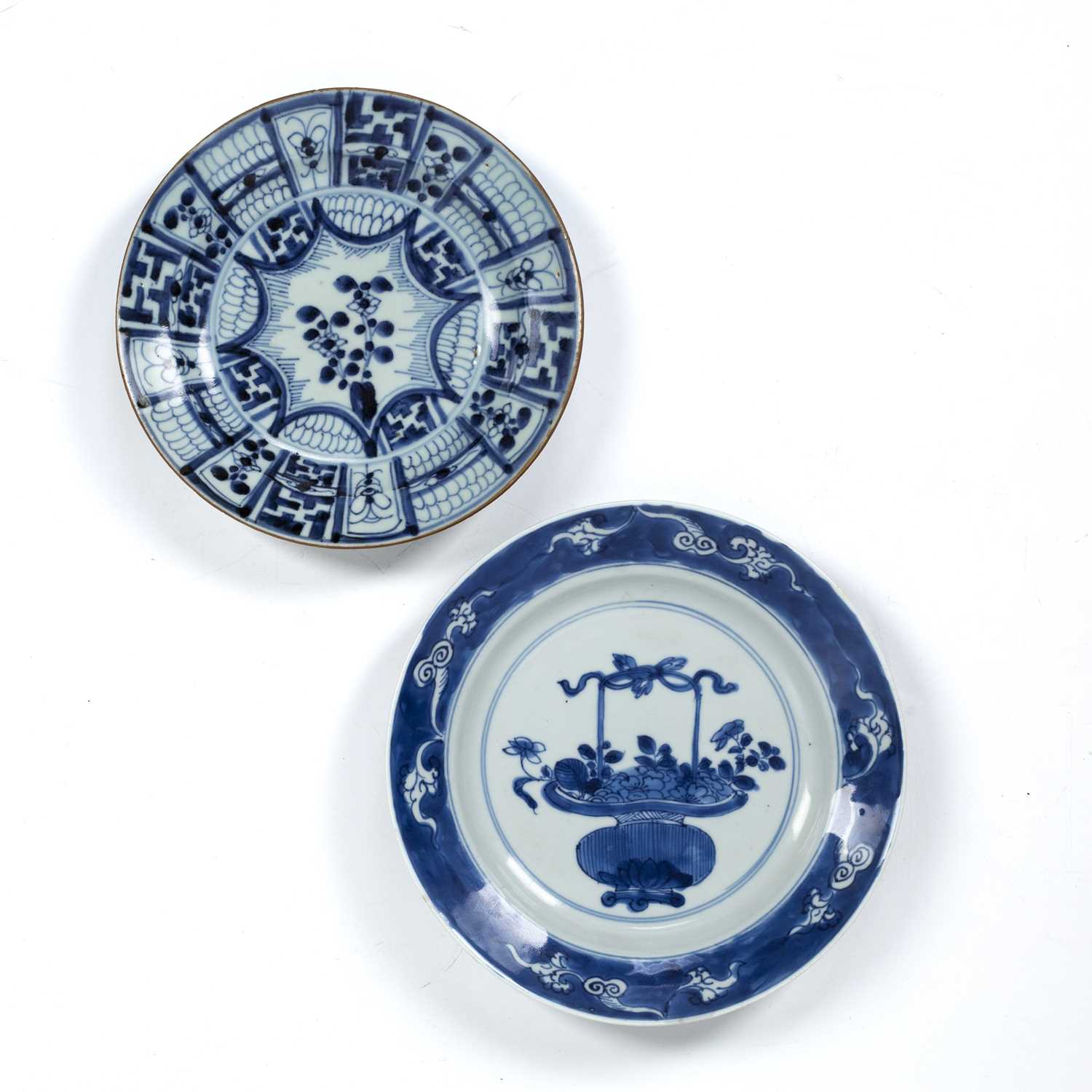 Two blue and white dishes Chinese, Kangxi period one painted with a basket of flowers, 21cm, and the