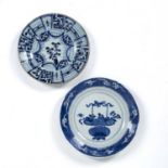 Two blue and white dishes Chinese, Kangxi period one painted with a basket of flowers, 21cm, and the