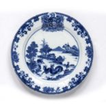 Blue and white dish Chinese, 18th Century decorated with goats grazing next to a river with a floral