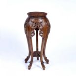 Urn stand Chinese style, 20th Century of circular form with carved supports, 83cm highCondition