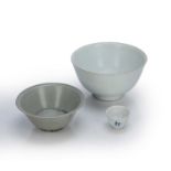 Three porcelain cargo bowls Chinese, 17th Century to include a monochrome white bowl, ex Christies