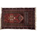 Red ground prayer rug Afghanistan with stylised foliate designs and panelled border, 130cm x