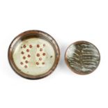 John Maltby (1936-2020) Small dish decorated with two shapes with red dots within a tenmoku border