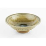 Jim Malone (b.1946) Footed bowl green ash glaze, the well with blue glaze and incised pattern