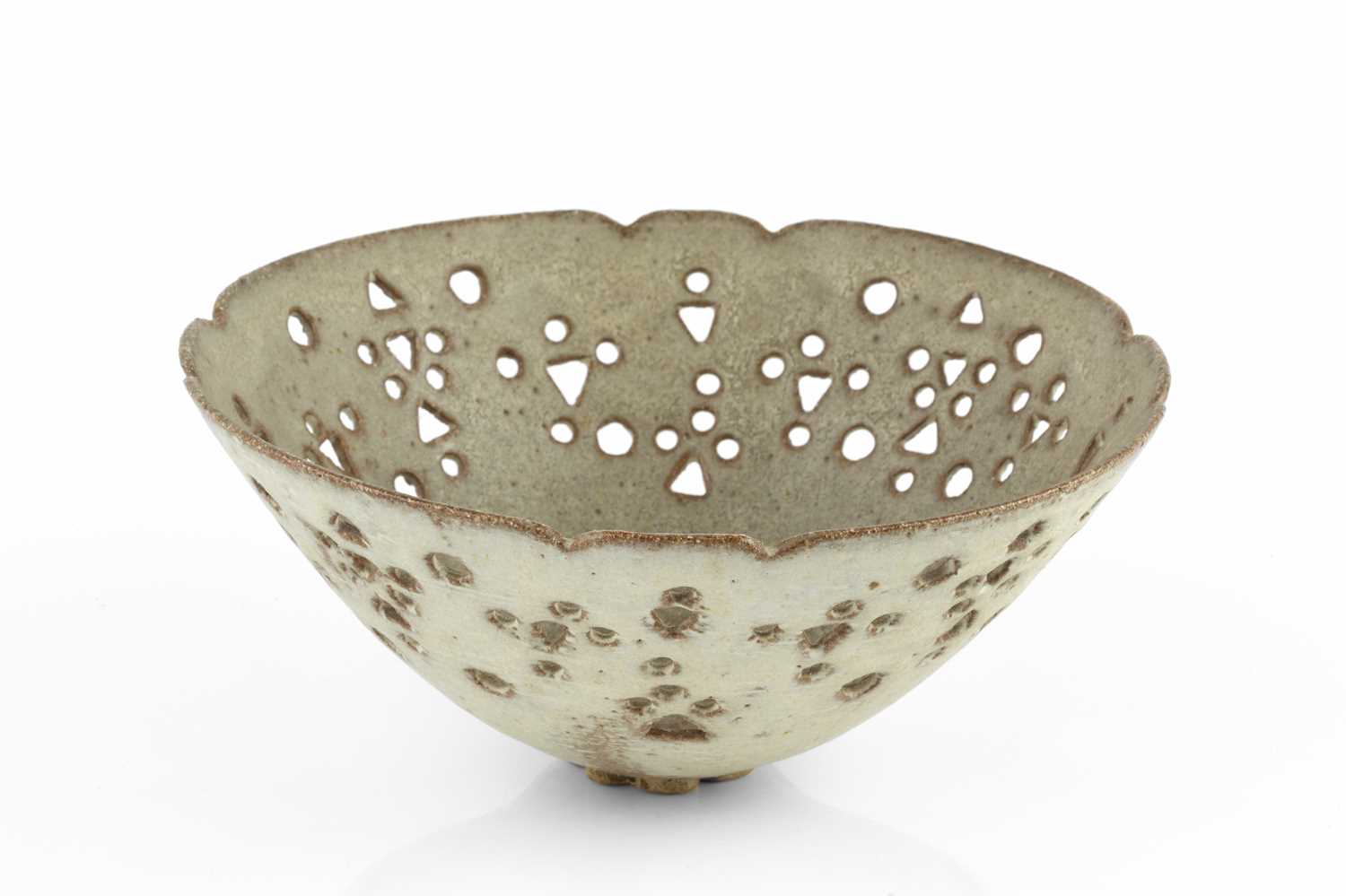 Ian Godfrey (1942-1992) Bowl oatmeal glaze, with pierced circles and triangles 9cm high, 19cm