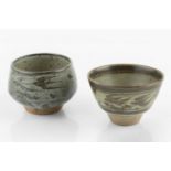 Helen Pincombe (1908-2004) Two tea bowls decorated with birds over grey glazes both with impressed