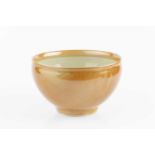 Gwyn Hanssen Pigott (1935-2013) Bowl tea dust glaze with gilt pattern to the well impressed potter's