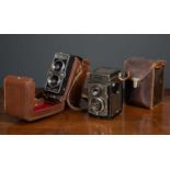 A Rollei Magic DBP DBGM Camera in a leather case together with a Rolleicord DRP DRGM camera in a