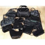 A collection of mostly black leather handbags to include a Radley black leather messenger style bag,