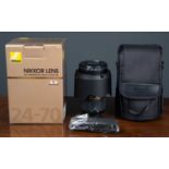 A Nikon AFS Nikkor 24-70mm f/2.8G ED N lens serial number 763725 with original box and case.