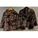 A collection of vintage Hippe fur coats comprising one long jacket, two shorter jackets, a