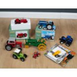 A collection of model tractors comprising of a Universal Hobbies Ford 5000 die cast chassis 1964 and