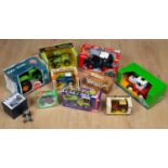A collection of boxes toy tractors comprising a Steiger die-cast panther ST310; a Ford die-cast