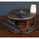A 19th Century 3 3/4" Fishing reel by Farlow of 191 Strand, London, with bone handle, signed, and