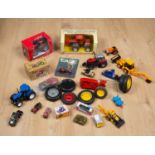 A collection of toy tractors to include an unboxed Ertl Allis-Chalmers die-cast 4W-305 tractor