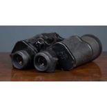 A pair of German binoculars, marked '7 x 50, 67321, rln', with hinged rubber eyepieces and a