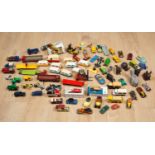 A collection of die-cast metal and plastic vehicles to include a boxed Ertl John Deere loader, 1:64;