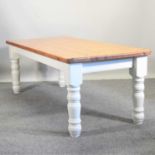 A pine and white painted dining table,
