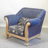 A gilt framed and blue upholstered armchair,