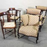 A pair of Edwardian upholstered armchairs,