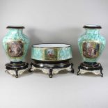An early 20th century French garniture of three vases,