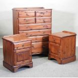 A modern stained pine chest of drawers,