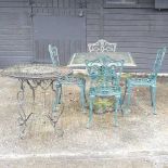 A green painted cast iron garden table,