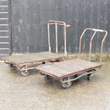 Two flat bed trolleys, together with another