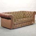 An early 20th century green upholstered chesterfield sofa,