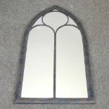 An arched garden mirror