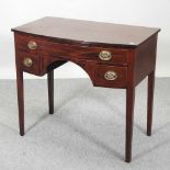 A 19th century mahogany bow front lowboy,