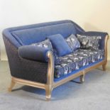 A modern gilt framed and blue upholstered sofa,