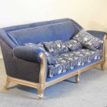 A gilt framed and blue upholstered sofa,