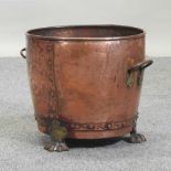 A hammered copper log basket,