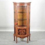 A 20th century marquetry and gilt metal mounted bow front display cabinet,