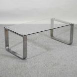 A modern chrome and glass coffee table,