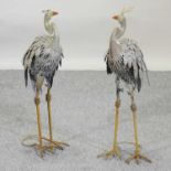 A pair of painted metal garden models of birds,