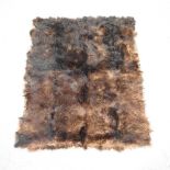 A brown bear skin rug,