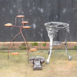 An iron table base,