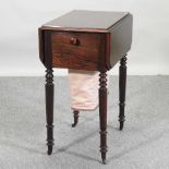 A 19th century mahogany work table,
