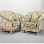 A pair of gilt framed and green geometric design upholstered armchairs