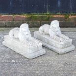 A pair of reconstituted stone models of sphinxes